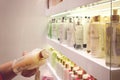 Kiev, Ukraine 19 September, 2018: Woman chooses cosmetics Body care product for the shower, bath, body lotion, Body spray